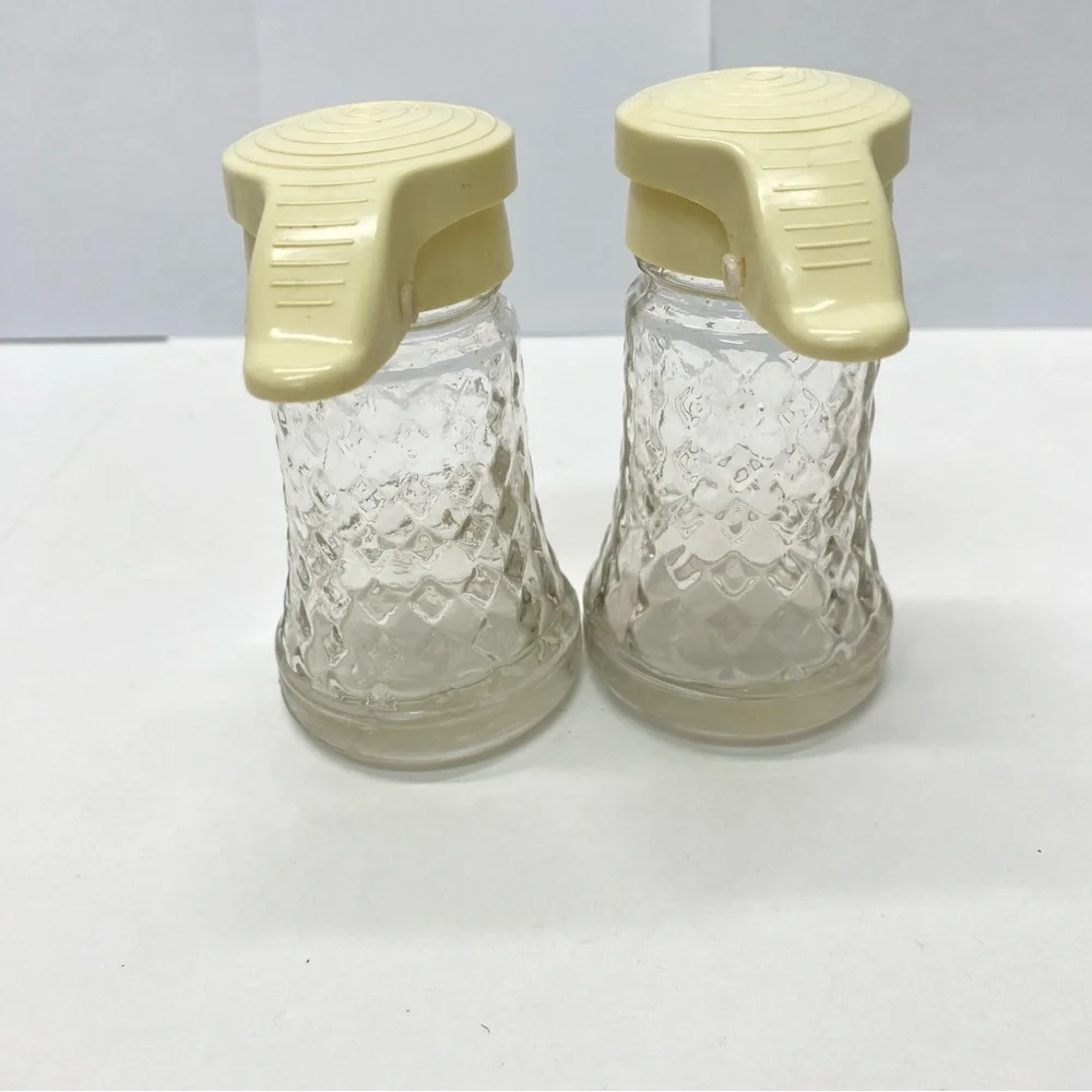 Vintage Daniells Salt and Pepper Shakers Set Beige Top Glass Bottom Plastic Tops